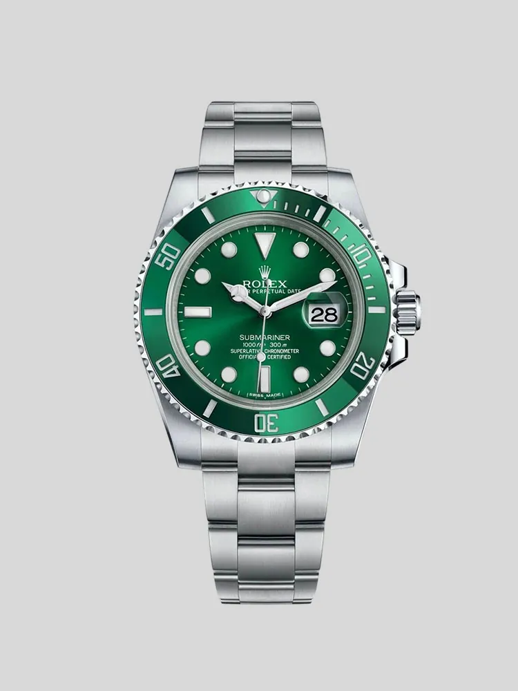 Rolex Submariner watch with a green dial, matching green bezel, and stainless steel bracelet.