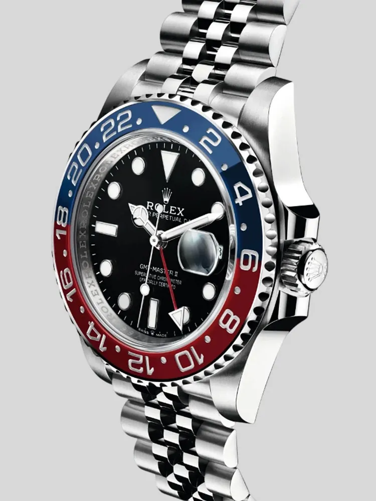 Rolex GMT-Master II watch with a black dial, red and blue bezel, and jubilee bracelet.