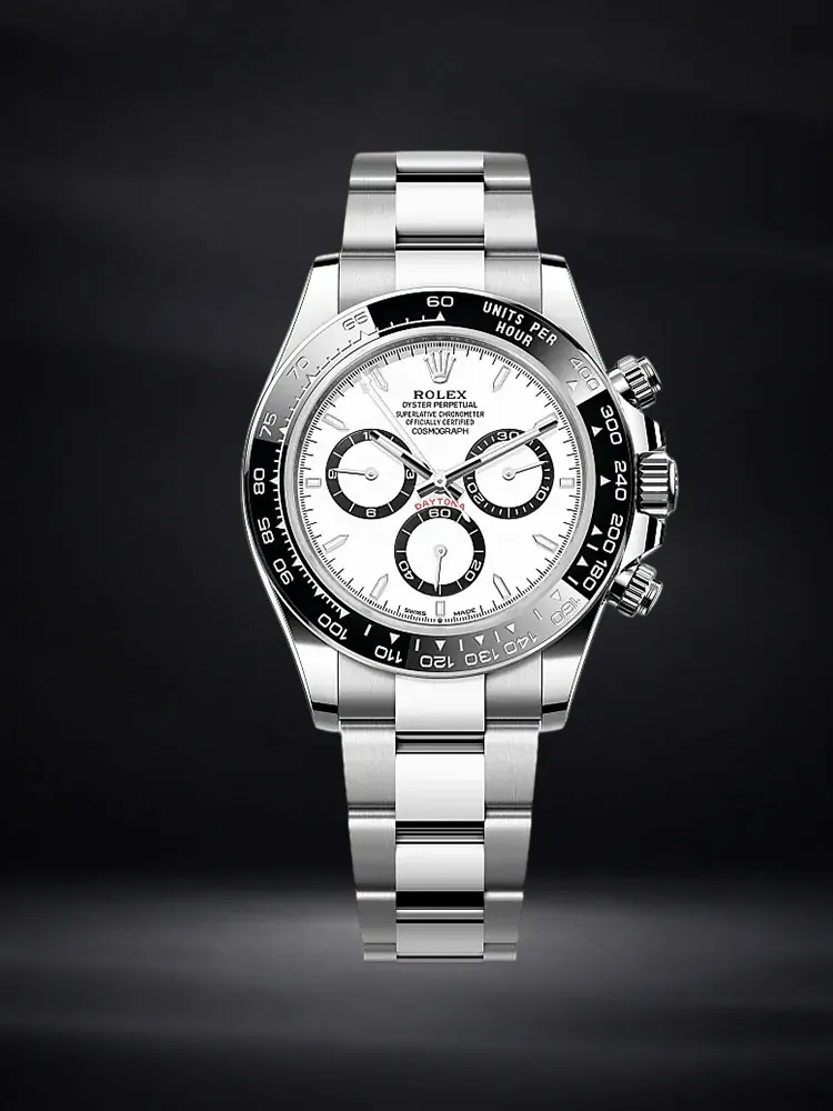 Rolex Daytona chronograph watch with a white dial and stainless steel bracelet on a deep navy background.