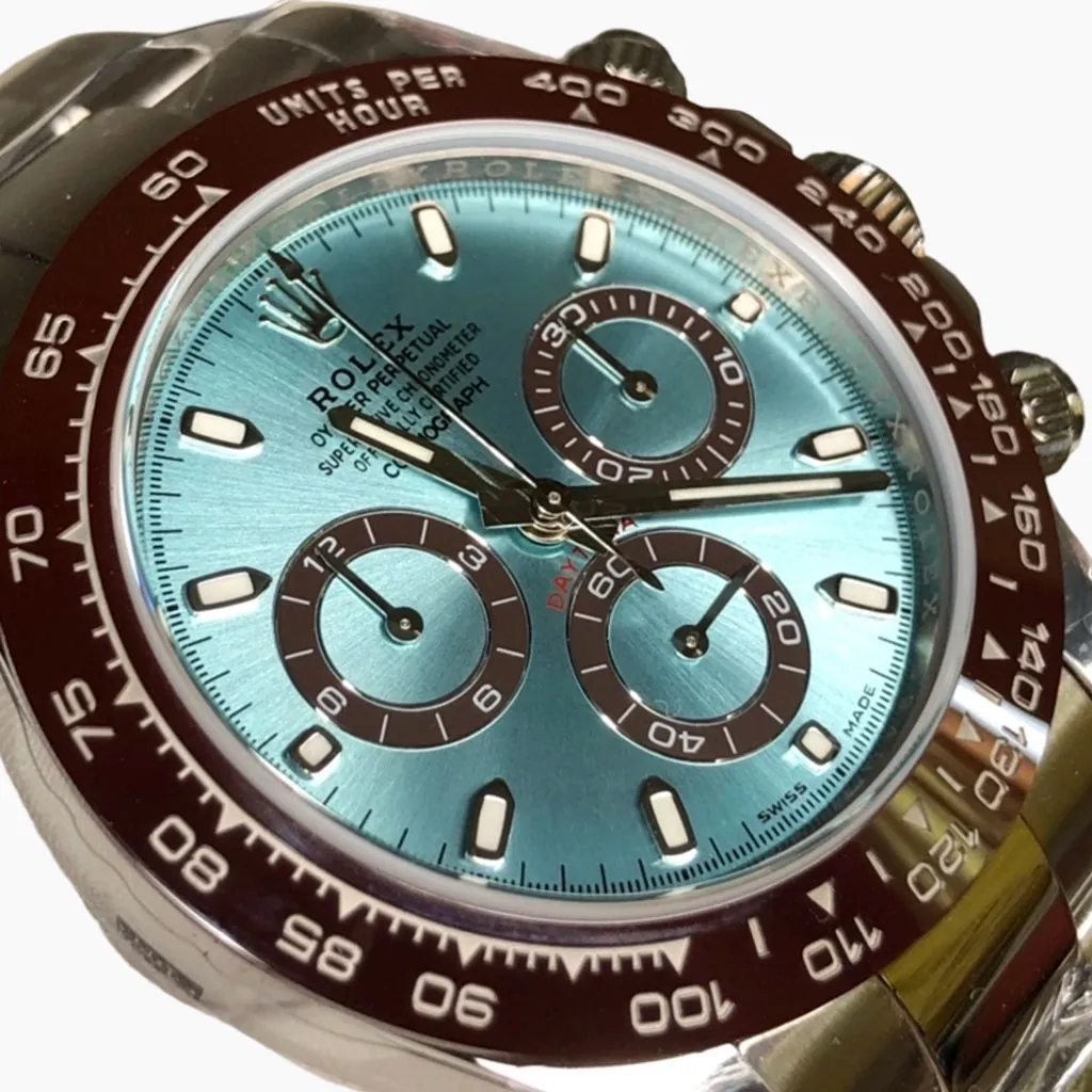 Daytona luxury chronograph watch with ice blue dial, brown tachymeter bezel, three subdials, and luminous hour markers