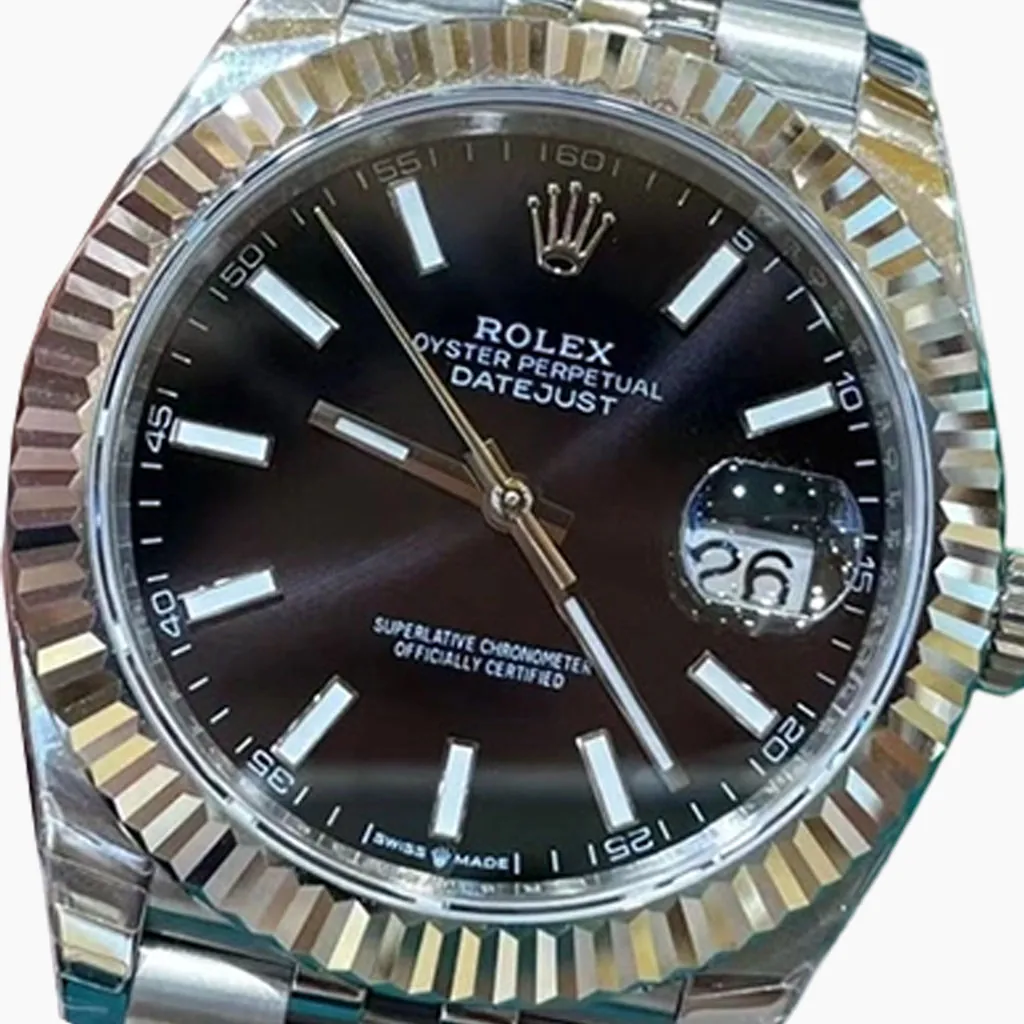 Rolex Datejust watch with black dial, silver hour markers, fluted bezel, and classic bracelet