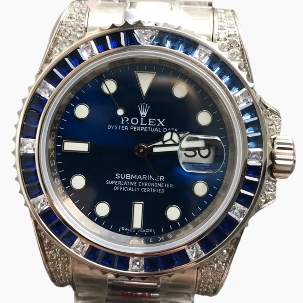 Rolex Submariner watch with blue dial, blue gemstone bezel, diamond lugs, date window, and stainless steel bracelet