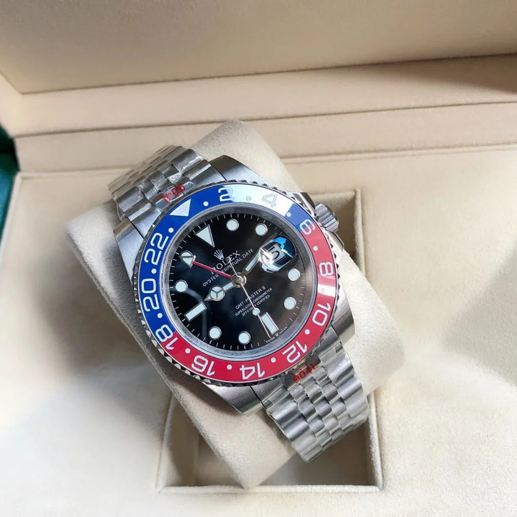 Rolex GMT-Master II Pepsi watch with black dial, red and blue 24-hour bezel, Jubilee bracelet and magnified date window in Rolex box