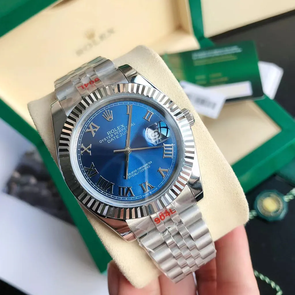 Rolex Oyster Perpetual Datejust blue dial watch with Roman numerals, fluted bezel, Jubilee bracelet, and green box.