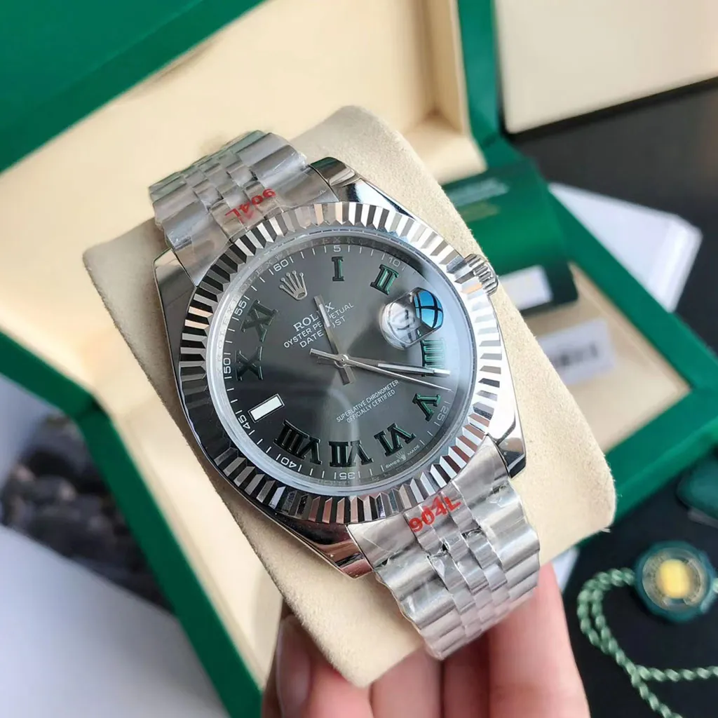 Rolex Oyster Perpetual Datejust grey dial watch with Roman numerals, fluted bezel, Jubilee bracelet, and green box.