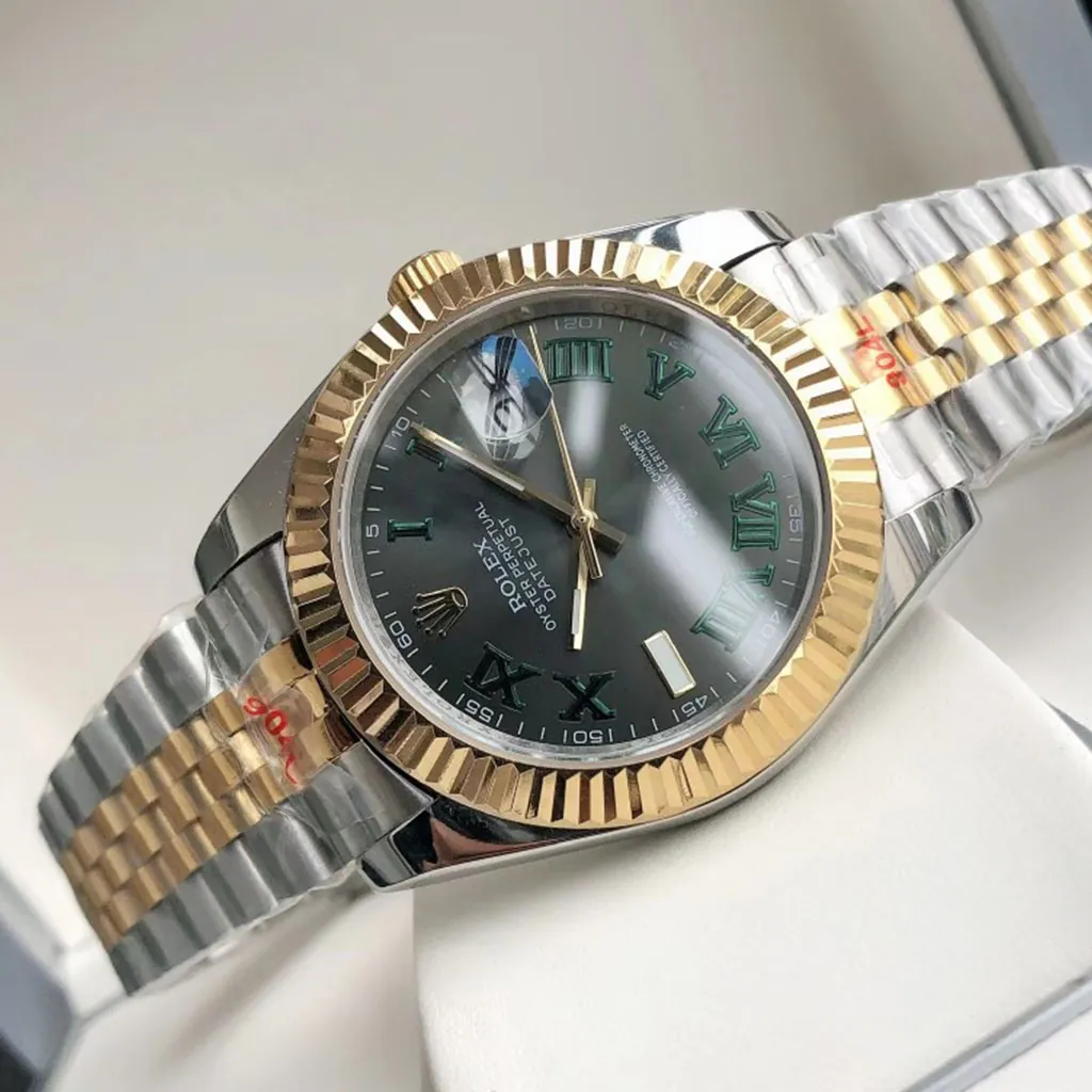 Rolex Oyster Perpetual Datejust two-tone watch with dark green Roman numeral dial, fluted gold bezel, date window, and Jubilee bracelet.