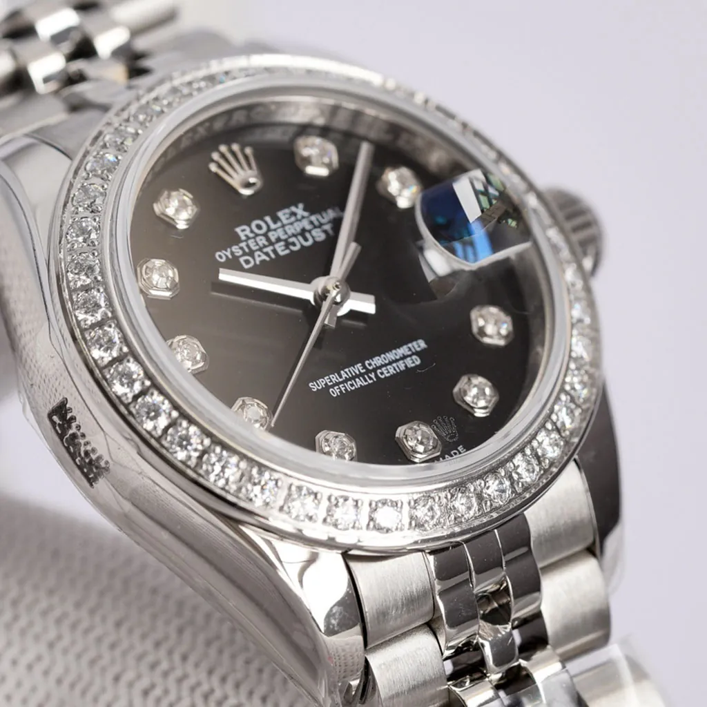 Rolex Datejust black dial watch with diamond bezel, diamond hour markers, Cyclops date window, and stainless steel Jubilee bracelet