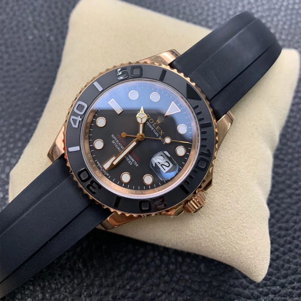Rolex Yacht-Master black dial watch with Everose gold case, black ceramic bezel, Cyclops date window, and black Oysterflex rubber strap
