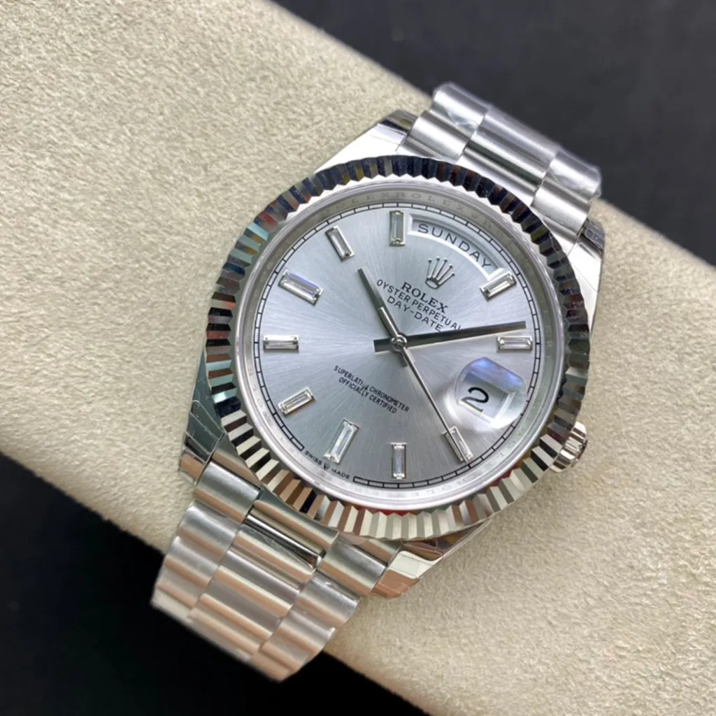 Rolex Oyster Perpetual Day-Date watch with silver dial, diamond hour markers, fluted bezel, and President bracelet.