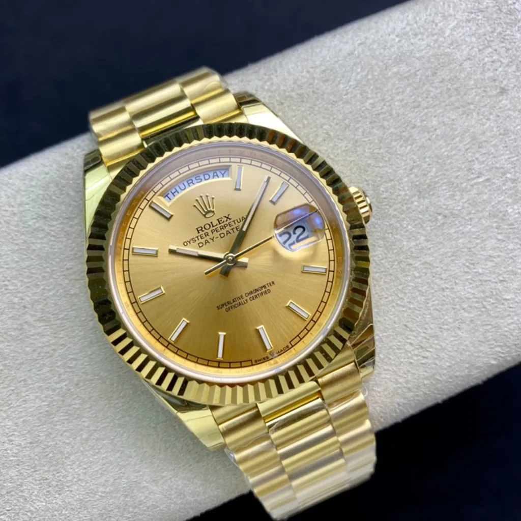 Rolex Oyster Perpetual Day-Date gold watch with champagne dial, fluted bezel, and President bracelet.