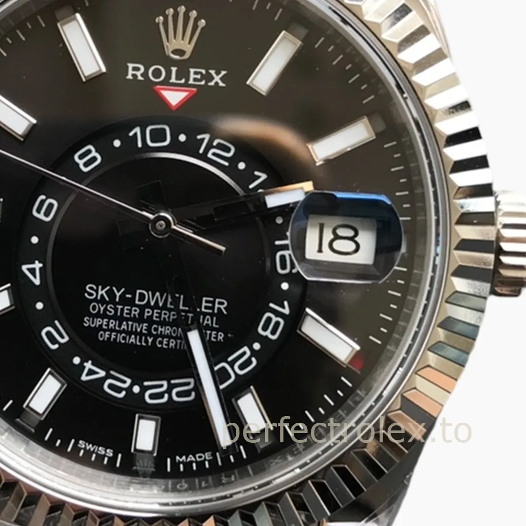 Rolex Sky-Dweller watch with black dial, fluted bezel, date window, 24-hour display, and baton hour markers close-up