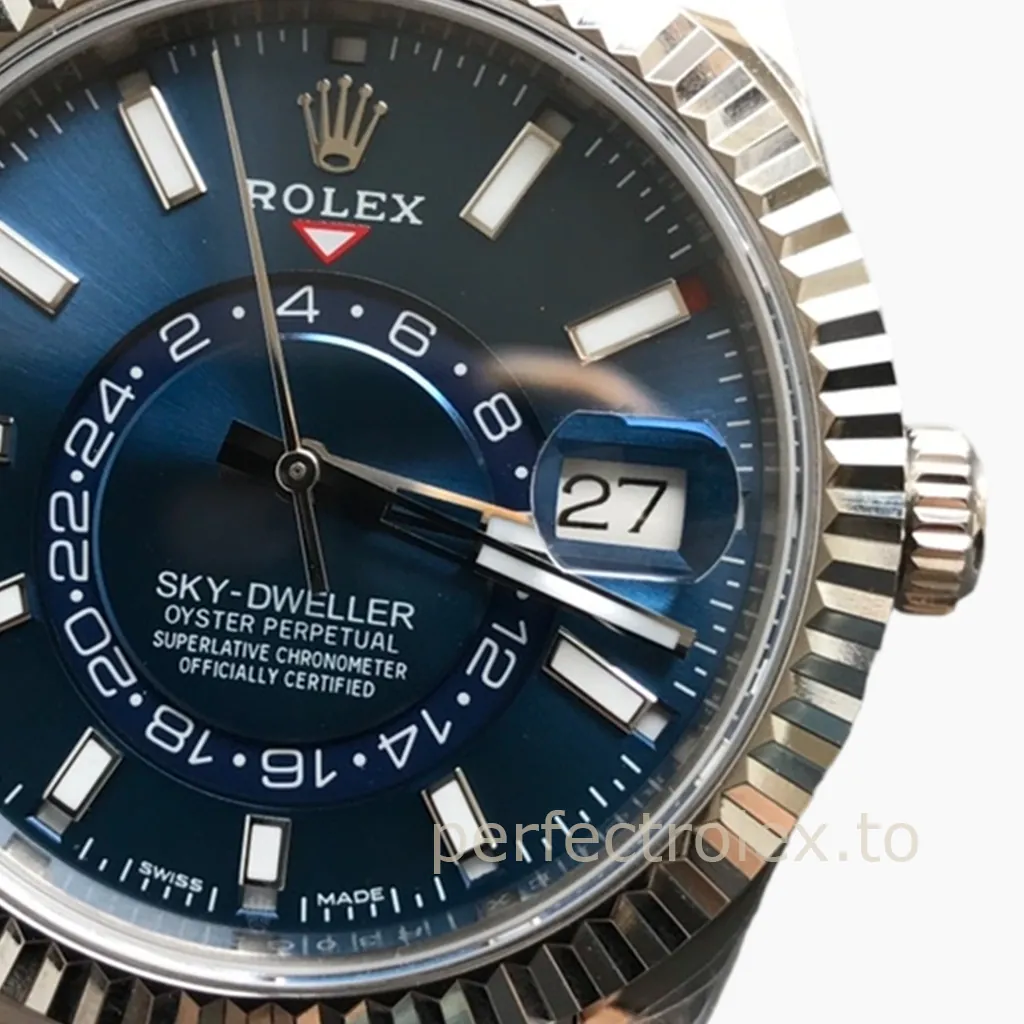 Rolex Sky-Dweller watch with blue dial, fluted bezel, date window, 24-hour display, and baton hour markers close-up
