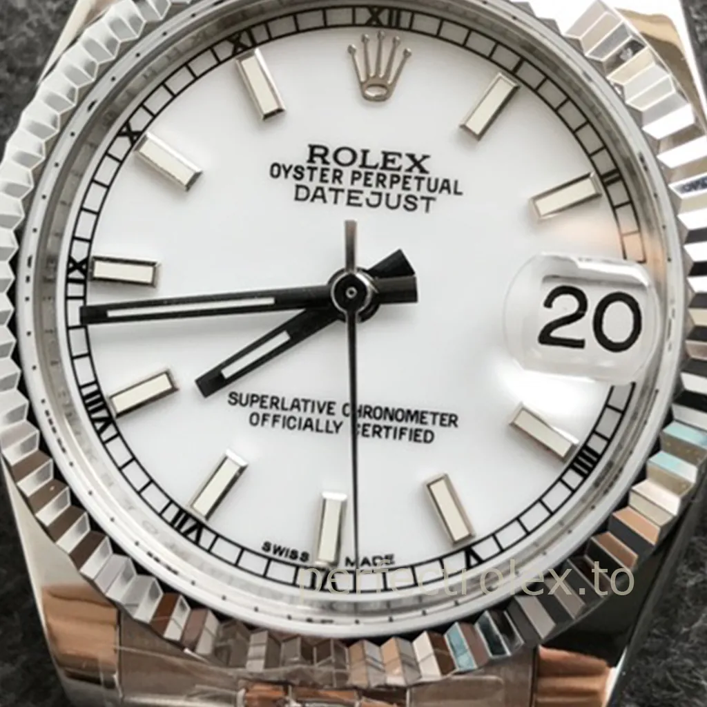 Rolex Datejust watch with white dial, fluted bezel, magnified date window, baton hour markers, and Jubilee bracelet close-up