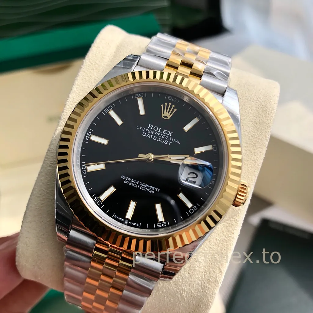 Rolex Datejust watch with black dial, gold fluted bezel, two-tone Jubilee bracelet, date window, and baton hour markers close-up