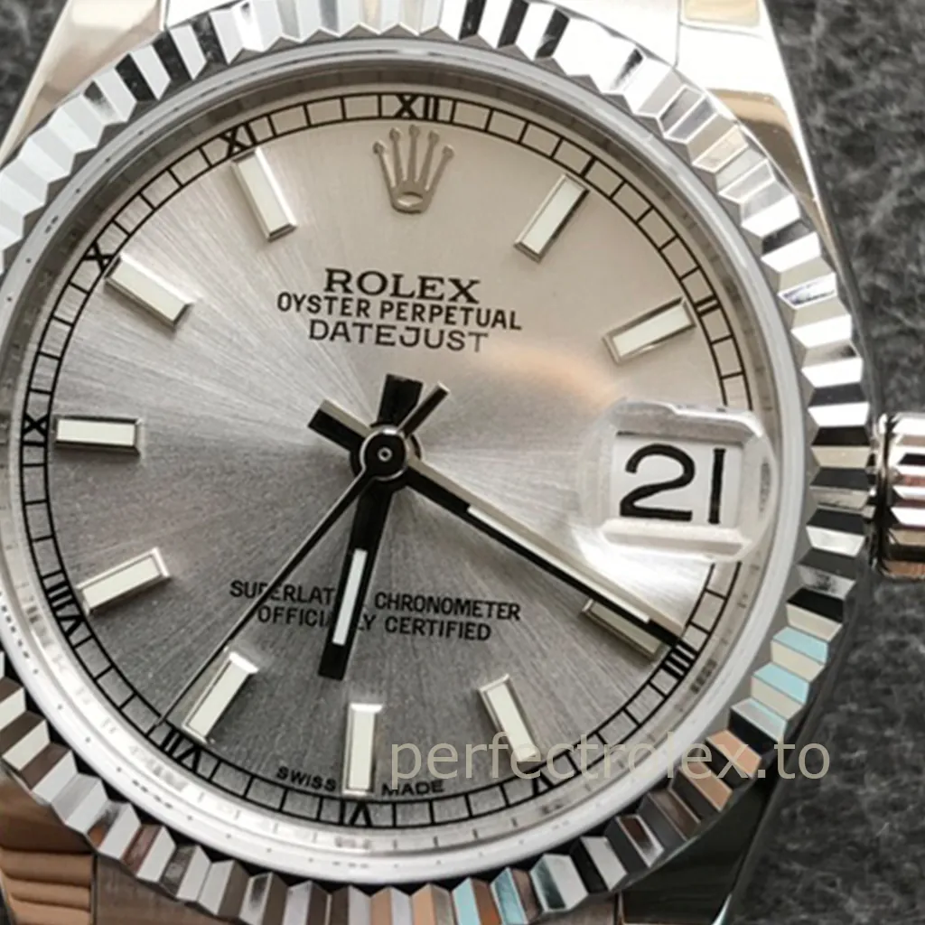 Rolex Datejust watch with silver sunburst dial, fluted bezel, magnified date window, baton hour markers, and close-up dial details