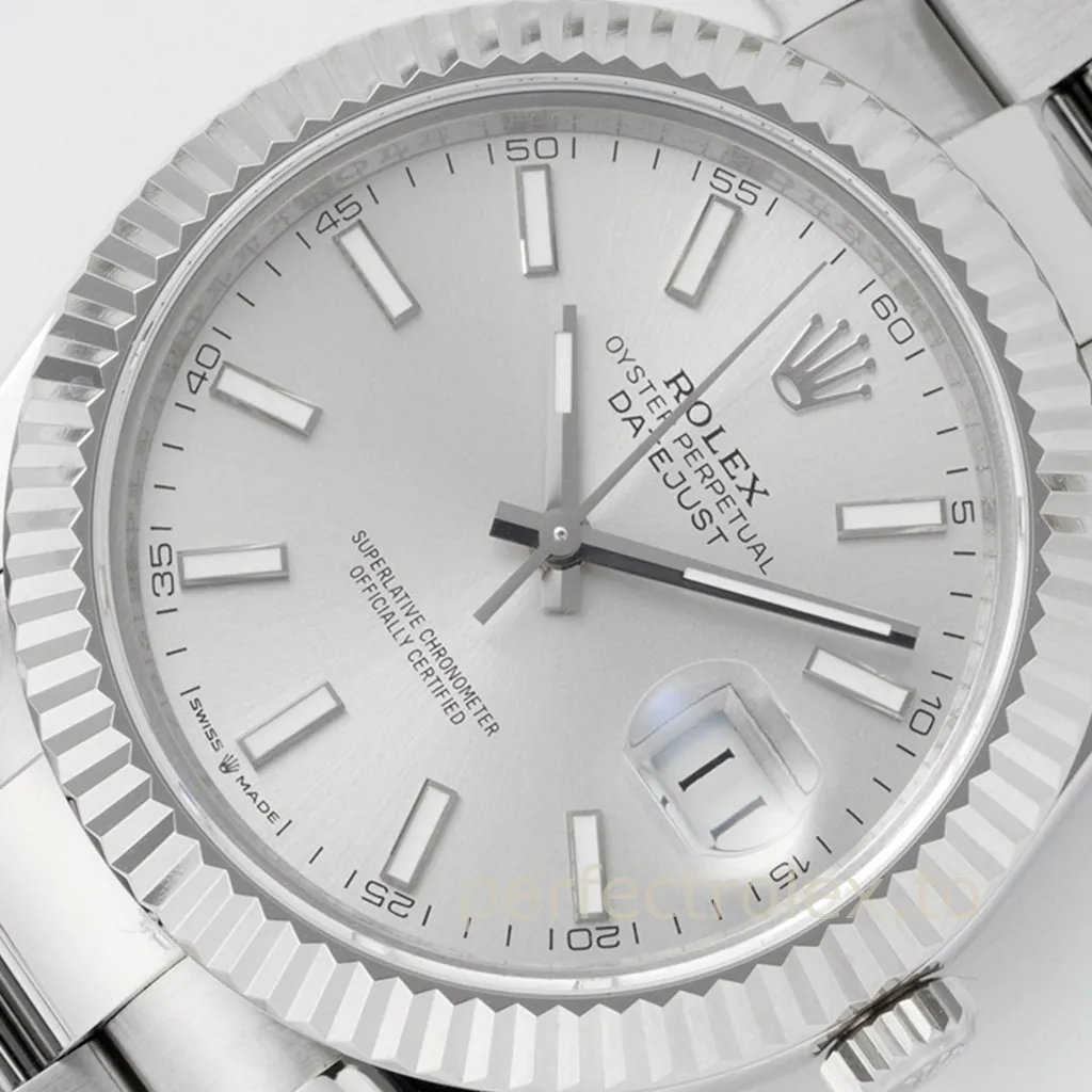 Rolex Oyster Perpetual Datejust silver dial watch with fluted bezel, Oyster bracelet, and Cyclops date window.