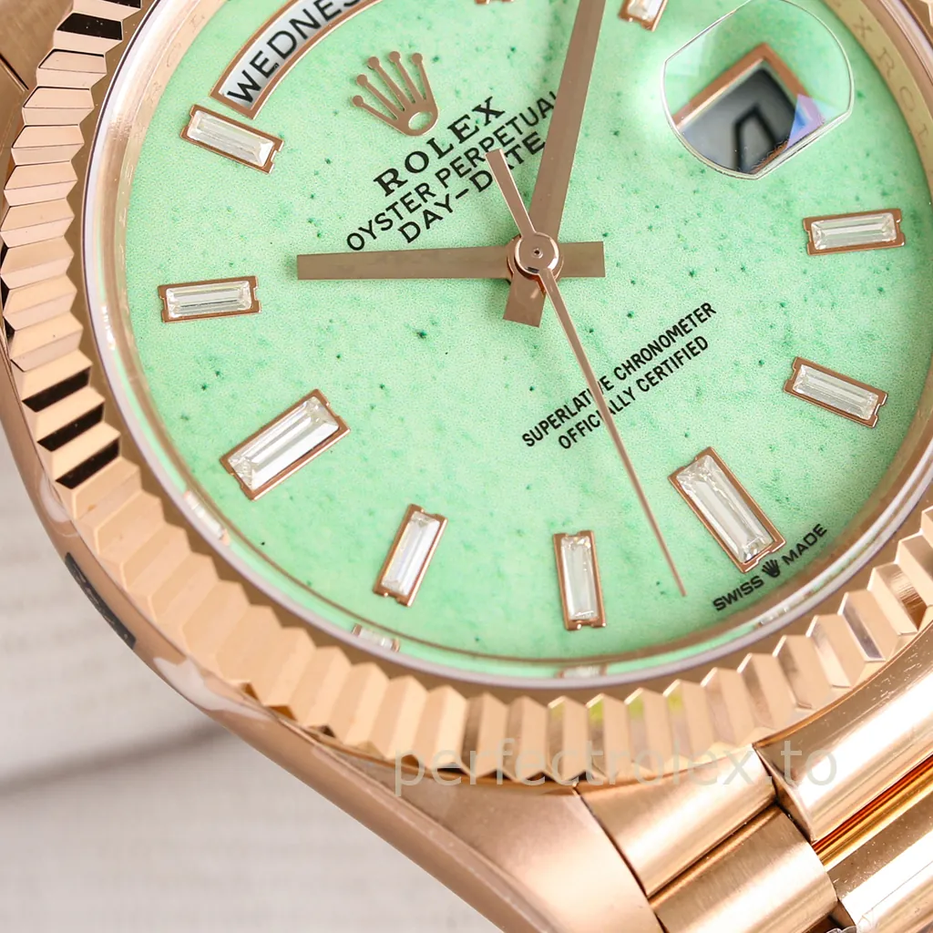Rolex Oyster Perpetual Day-Date watch in Everose gold with a green dial, baguette diamond hour markers, fluted bezel, day display and date window.