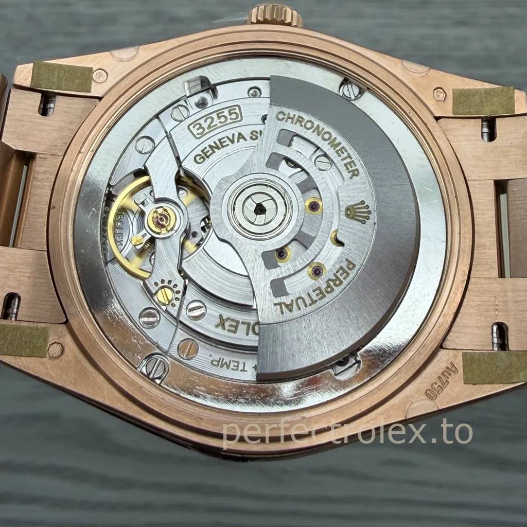 Rolex Day-Date 40 Caliber 3255 automatic movement with Perpetual rotor, chronometer markings, and an Everose gold exhibition caseback.