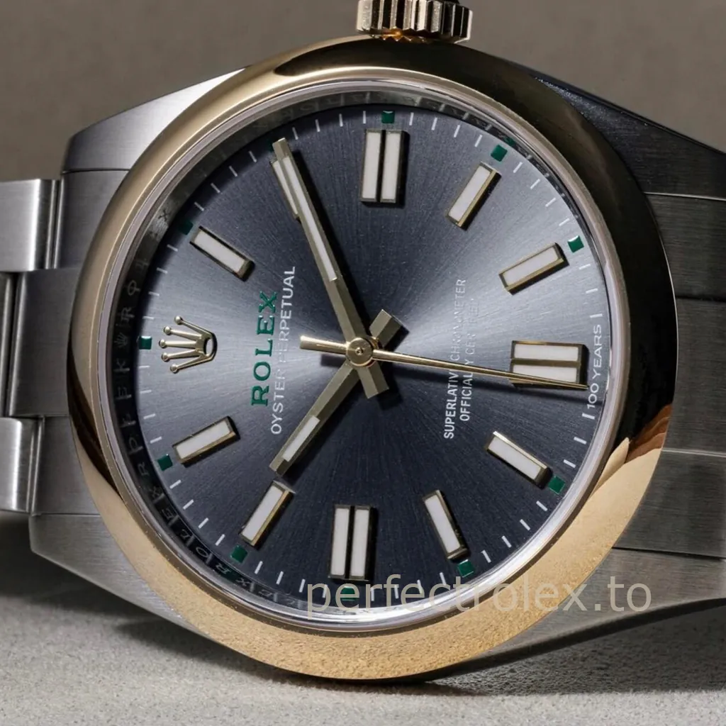 Rolex Oyster Perpetual 100 Years watch with a blue sunburst dial, luminous baton markers, green accents, and a steel bracelet.