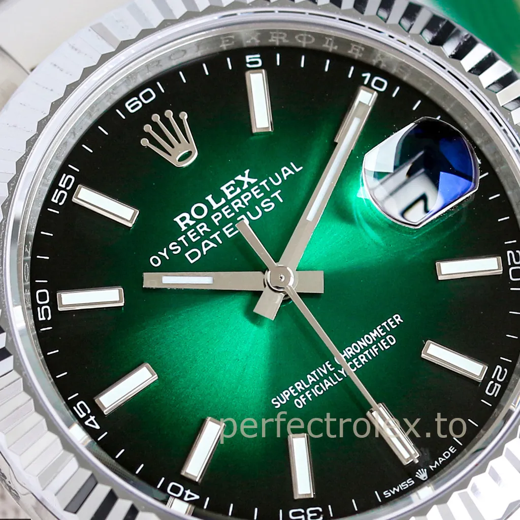 Rolex Oyster Perpetual Datejust watch with a green sunburst dial, fluted bezel, luminous baton markers, and Cyclops date window.