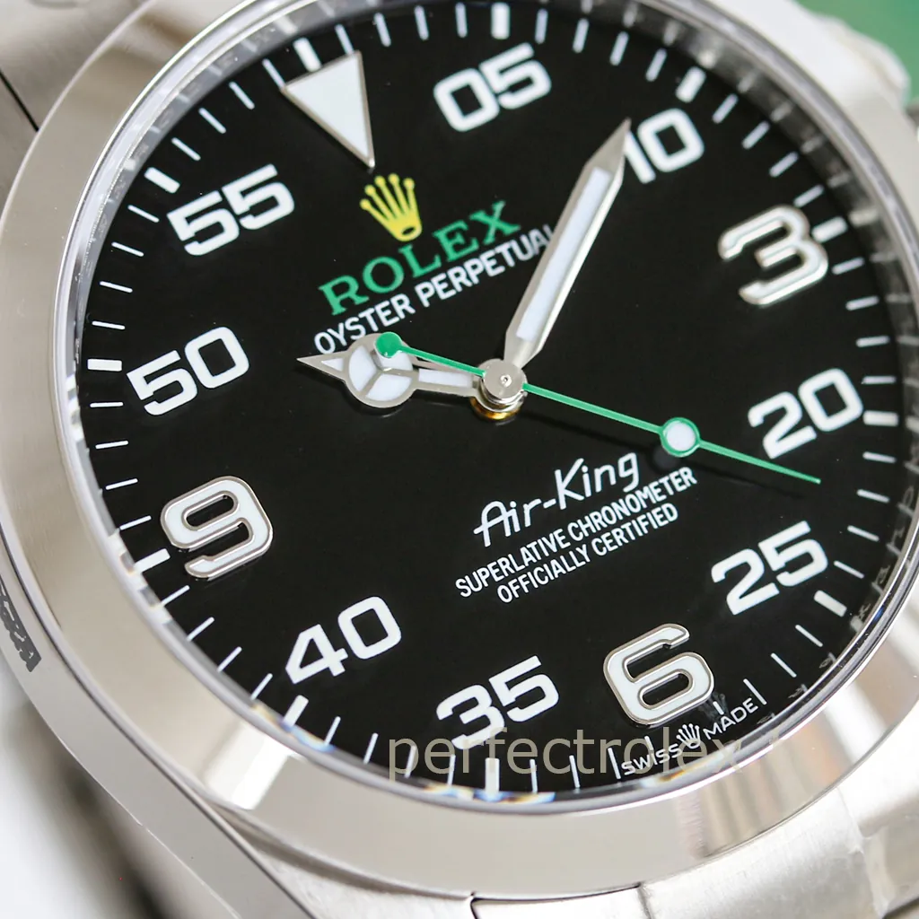 Rolex Oyster Perpetual Air-King with black dial, white aviation numerals, luminous hands, green seconds hand, and stainless steel case.