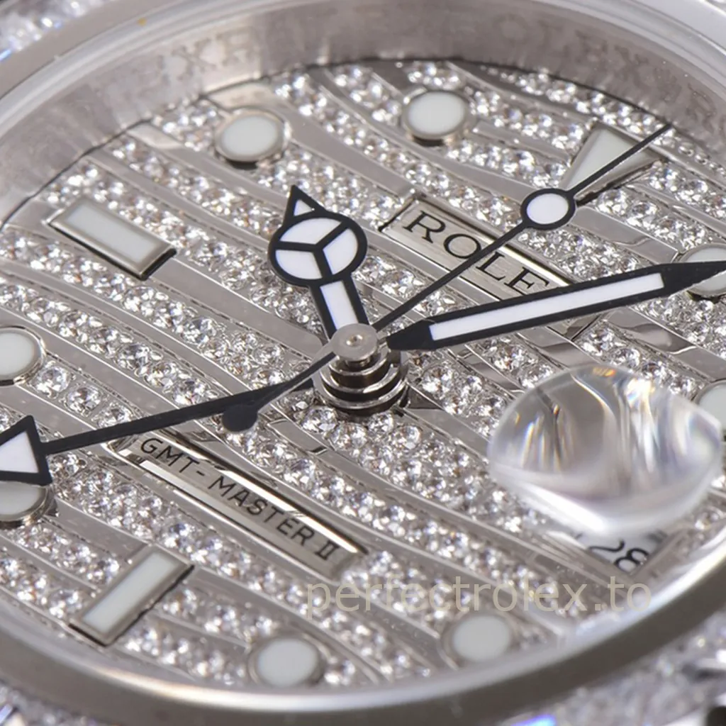 Rolex GMT-Master II with diamond pavé dial, luminous hour markers, Mercedes hands, and Cyclops date window.