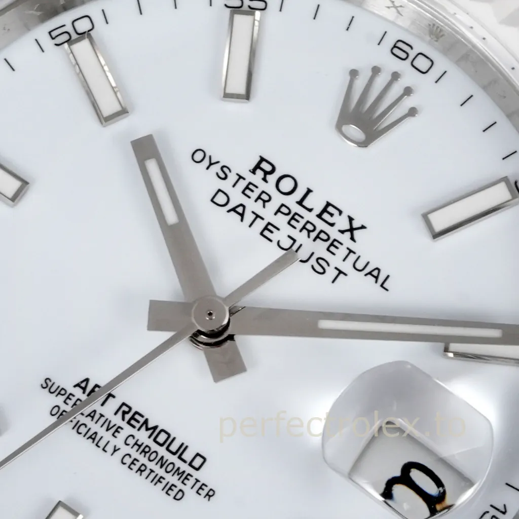 Close-up of an AET Remould Rolex Datejust with a white dial, luminous hour markers, silver hands, and Cyclops date window.