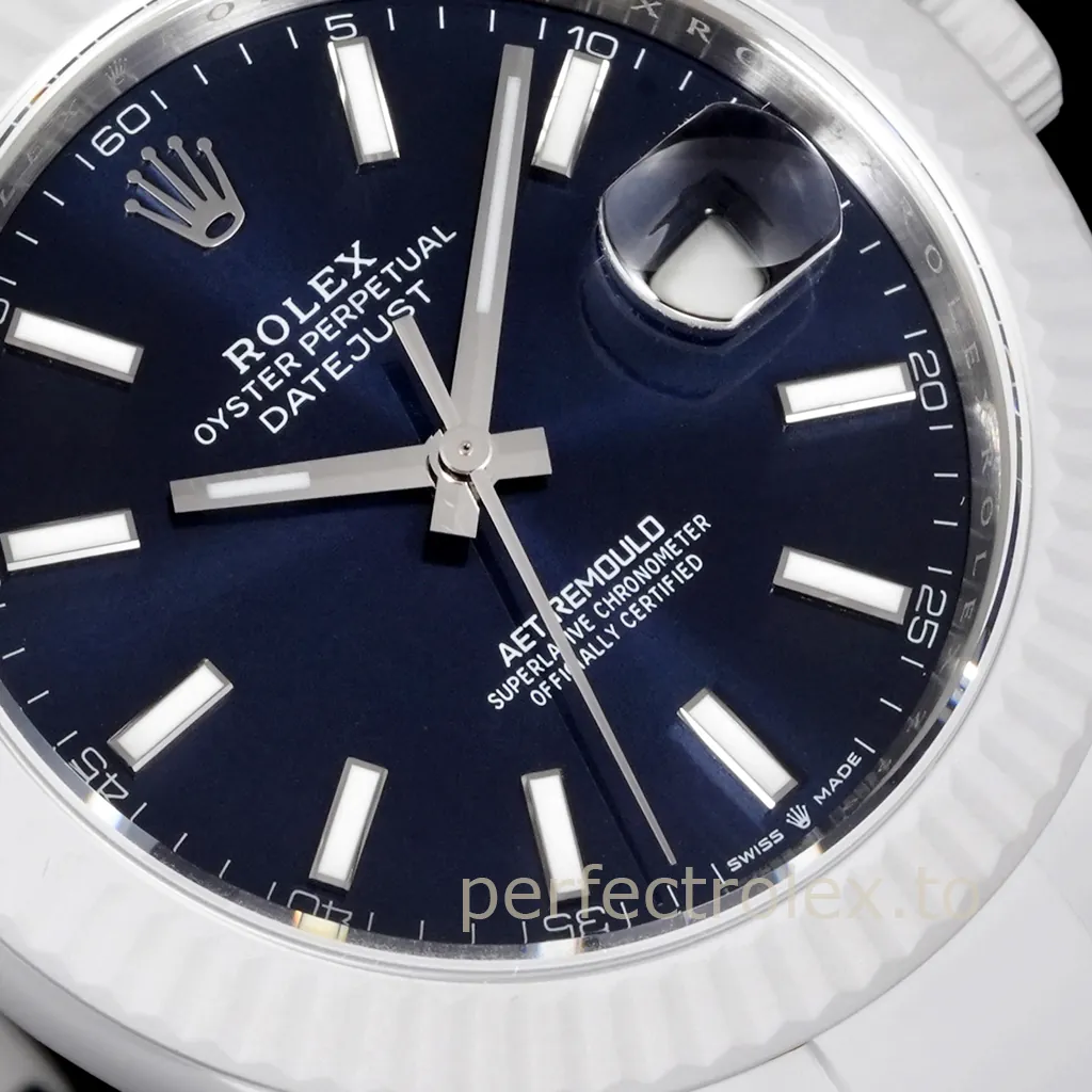Close-up of a custom AET Remould Rolex Datejust with a blue dial, white ceramic case, luminous hour markers, and Cyclops date window.