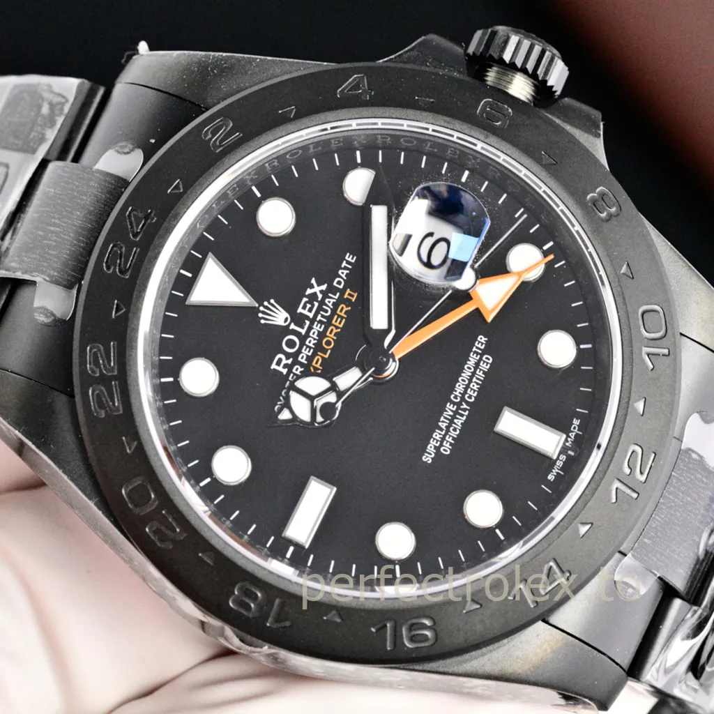 Rolex Explorer II Oyster Perpetual Date watch with a black dial, orange GMT hand, luminous markers, 24-hour bezel, and magnified date window.