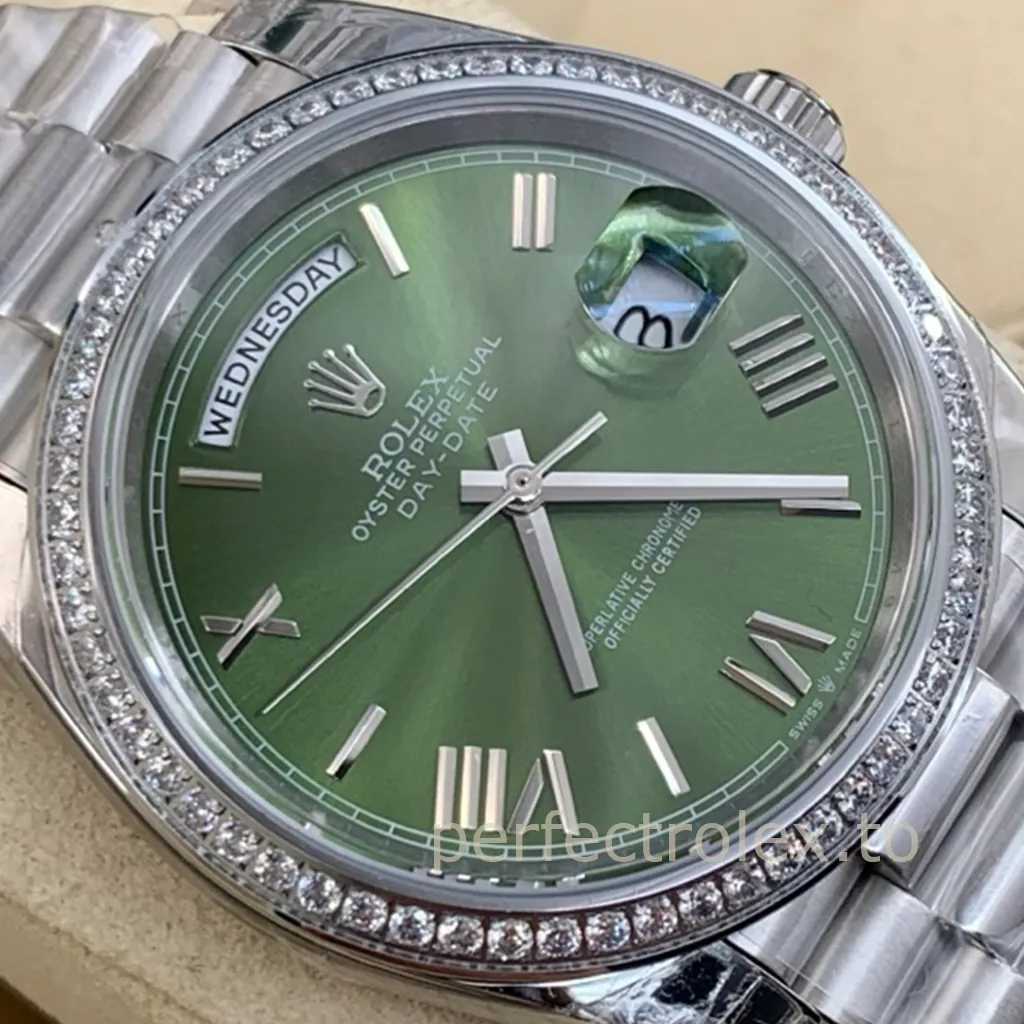 Rolex Oyster Perpetual Day-Date with a green dial, diamond-set bezel, Roman numeral hour markers, Cyclops date window and President bracelet.