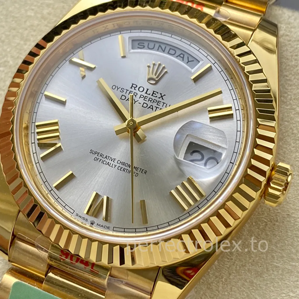 Rolex Day-Date yellow gold watch with a silver sunburst dial, gold Roman numeral markers, fluted bezel, President bracelet, full-day display, and Cyclops date window.